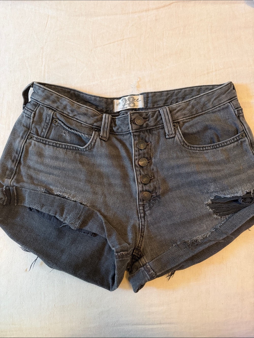 Free People | We The Free High-Rise Distressed Black Denim Shorts - Button Front